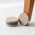 Felt furniture floor pads bundle on white surface
